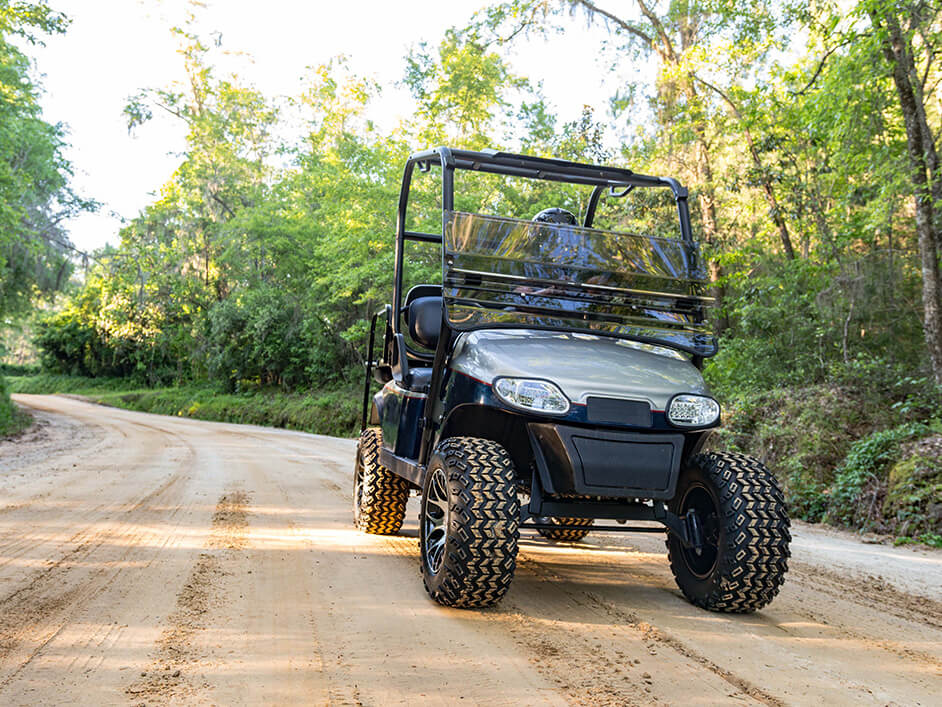 golf cart on dirt road